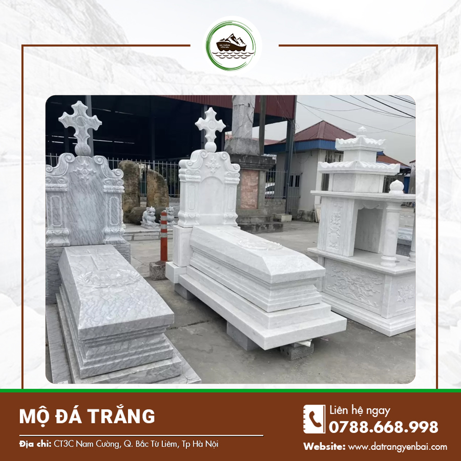 Mộ đôi bằng đá trắng với bia đá khắc tên sắc nét và họa tiết tôn nghiêm.