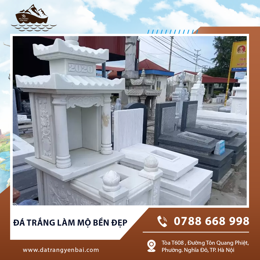 Mộ đá trắng ngoài trời với hoa văn tinh xảo và chắc chắn.